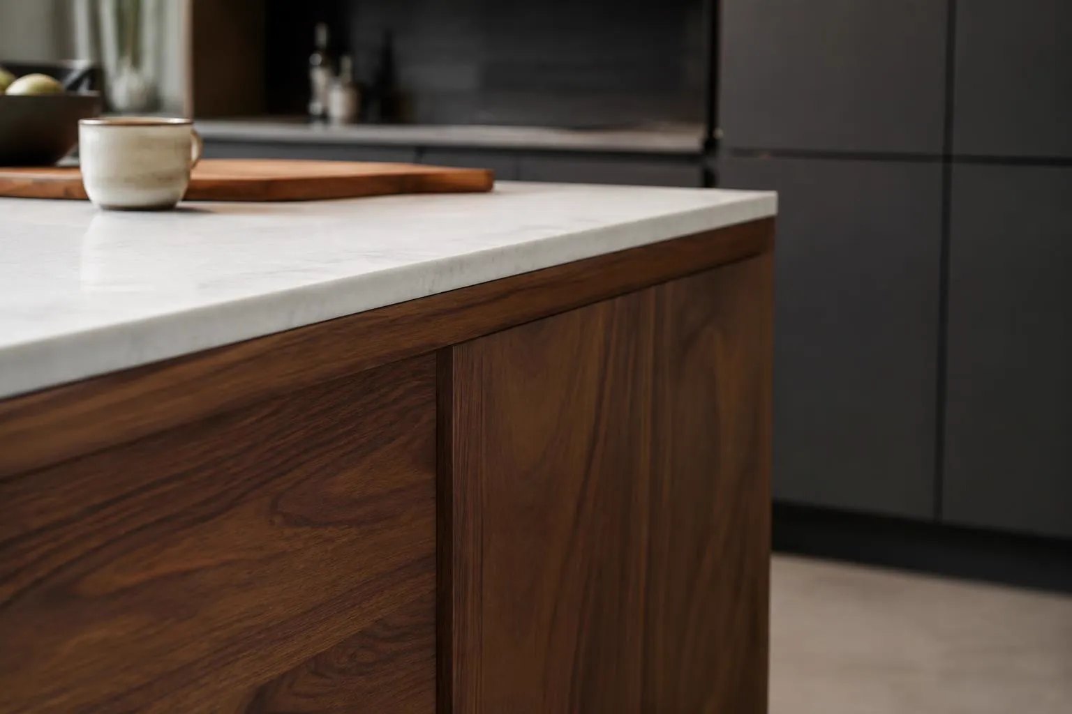Walnut kitchen island edge under a white stone countertop