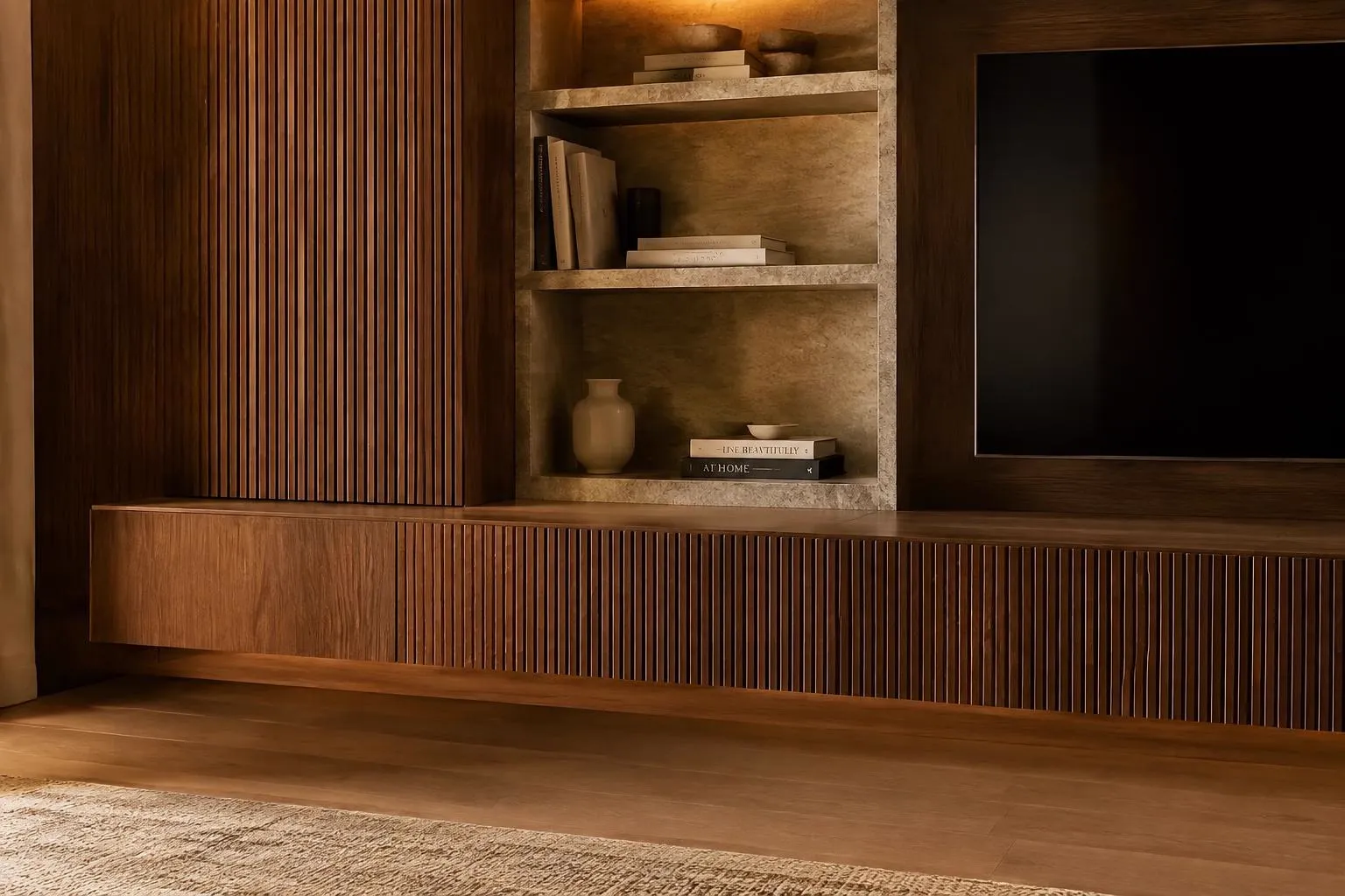 Fluted walnut media console with lit stone-look shelving